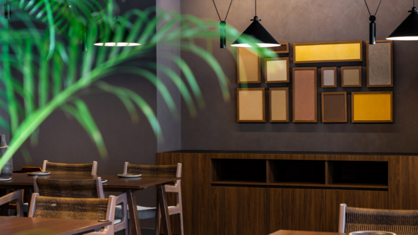 Hospitality restaurant interior with curated wall art integrated into architectural and interior design concept