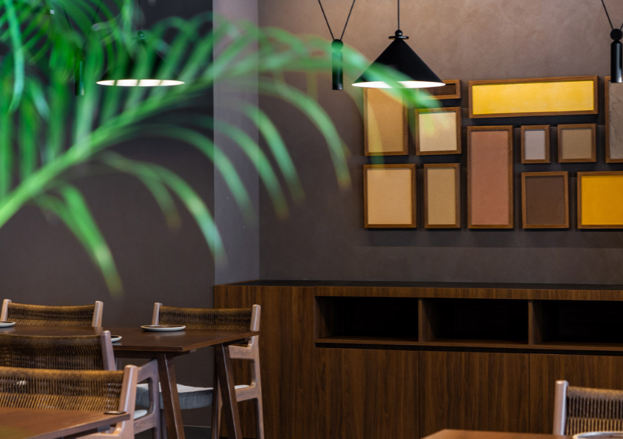 Hospitality restaurant interior with curated wall art integrated into architectural and interior design concept
